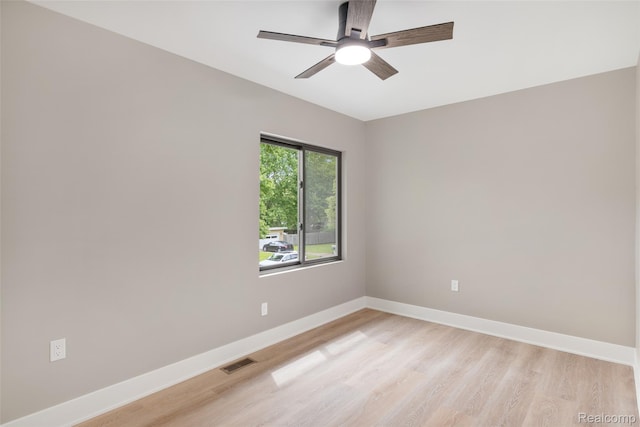 7598 Lake Park Rd, Ira, MI 48023 - empty room with baseboards, light wood-style flooring, and a ceiling fan