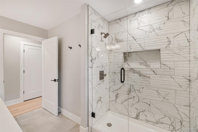 7598 Lake Park Rd, Ira, MI 48023 - bathroom with a stall shower and baseboards