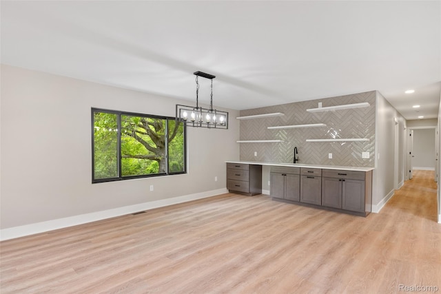 7598 Lake Park Rd, Ira, MI 48023 - bar featuring decorative backsplash, light wood-style flooring, baseboards, pendant lighting, and recessed lighting