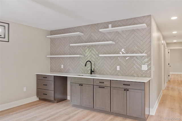 7598 Lake Park Rd, Ira, MI 48023 - bar with a sink, light wood-style floors, baseboards, tasteful backsplash, and recessed lighting