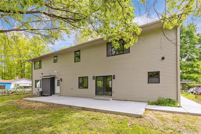 7598 Lake Park Rd, Ira, MI 48023 - back of house featuring a patio, cooling unit, and a yard