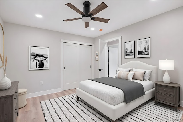 7598 Lake Park Rd, Ira, MI 48023 - bedroom with light wood-style floors, a closet, recessed lighting, baseboards, and a ceiling fan