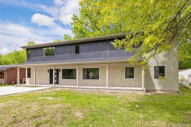 7598 Lake Park Rd, Ira, MI 48023 - view of front of property featuring a front yard and brick siding