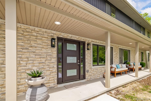 7598 Lake Park Rd, Ira, MI 48023 - property entrance featuring covered porch and stone siding