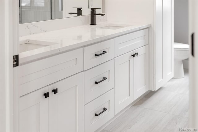 7598 Lake Park Rd, Ira, MI 48023 - bathroom with toilet and double vanity
