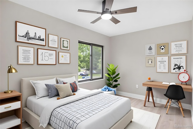 7598 Lake Park Rd, Ira, MI 48023 - bedroom with wood finished floors, a desk, and baseboards