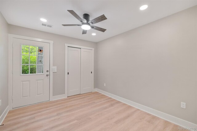 7598 Lake Park Rd, Ira, MI 48023 - unfurnished bedroom with light wood-style floors, baseboards, recessed lighting, a closet, and a ceiling fan