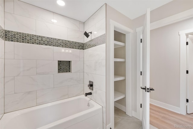 7598 Lake Park Rd, Ira, MI 48023 - bathroom featuring shower / bath combination, a closet, baseboards, wood finished floors, and recessed lighting