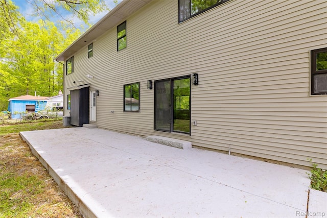7598 Lake Park Rd, Ira, MI 48023 - back of property featuring a patio area