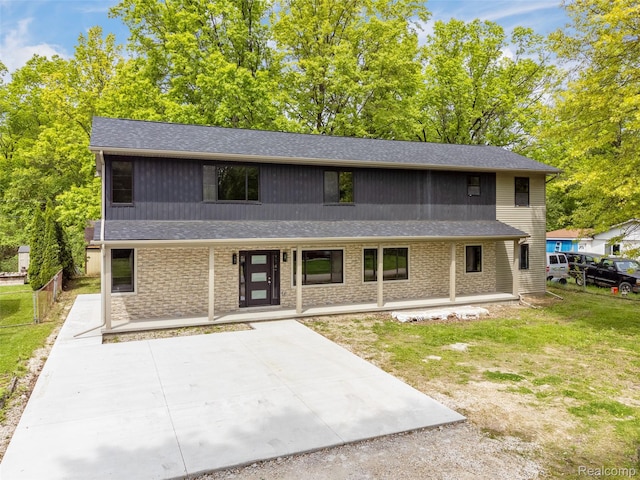 7598 Lake Park Rd, Ira, MI 48023 - view of front of house featuring a shingled roof and a porch