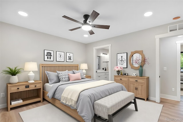 7598 Lake Park Rd, Ira, MI 48023 - bedroom featuring light wood-style floors, baseboards, recessed lighting, ensuite bath, and a ceiling fan