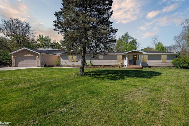 view of front facade featuring concrete driveway, an attached garage, and a front yard