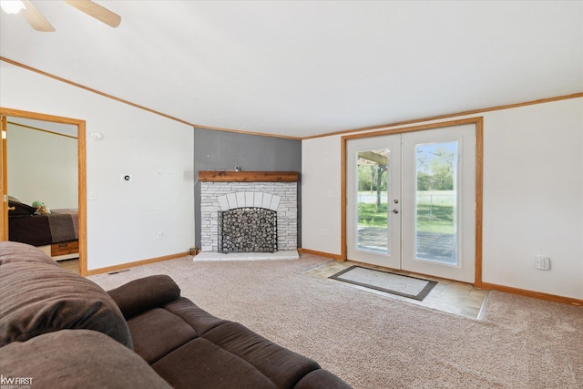 living area featuring crown molding, carpet, baseboards, french doors, and ceiling fan