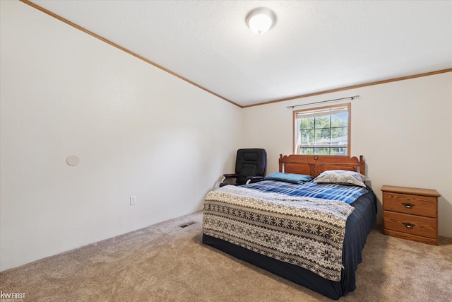 carpeted bedroom with ornamental molding