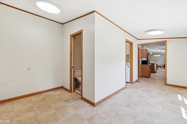 corridor featuring crown molding and baseboards