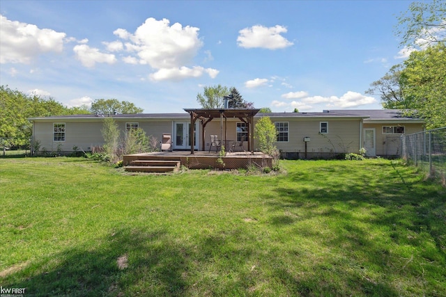 back of property featuring a wooden deck and a pergola