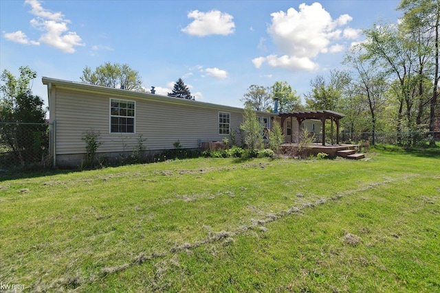 back of property featuring a pergola
