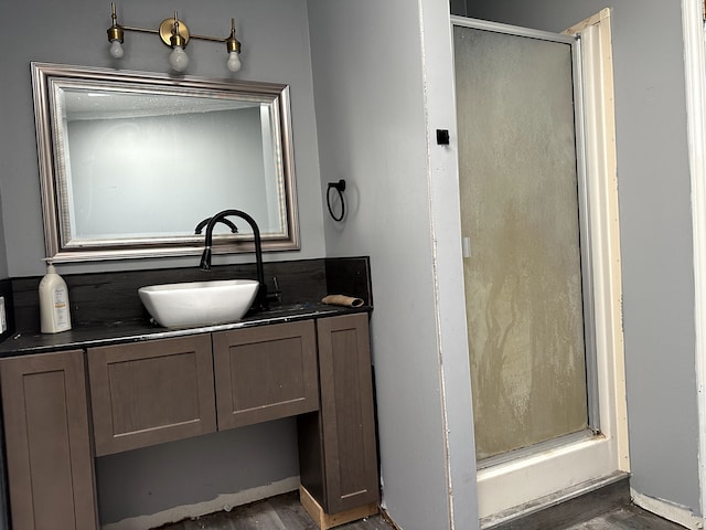 5151 Huntley Dr, Holly, MI 48442 - full bath with a shower stall, vanity, and wood finished floors