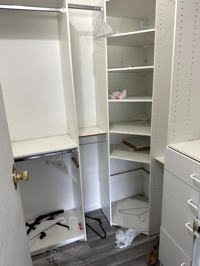 5151 Huntley Dr, Holly, MI 48442 - walk in closet featuring dark wood-style floors