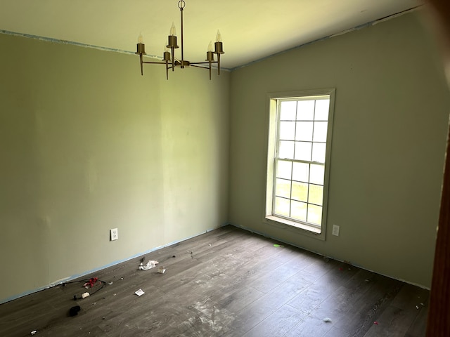 5151 Huntley Dr, Holly, MI 48442 - spare room with a chandelier and wood finished floors