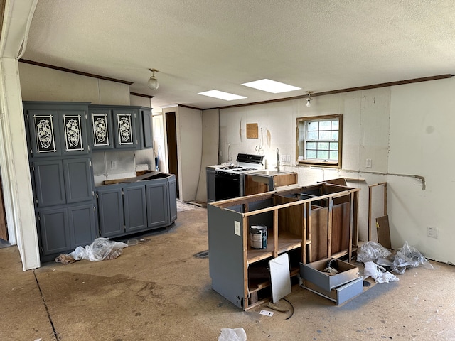 5151 Huntley Dr, Holly, MI 48442 - kitchen featuring gas range oven, a textured ceiling, and ornamental molding