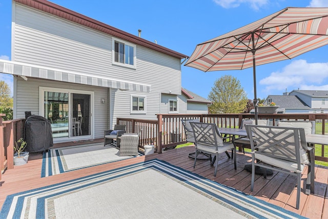 deck featuring outdoor dining area