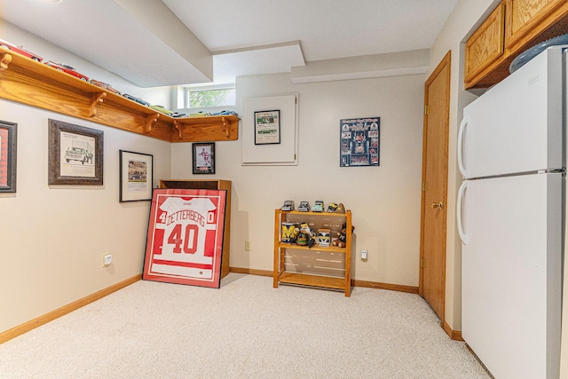 playroom with light carpet and baseboards