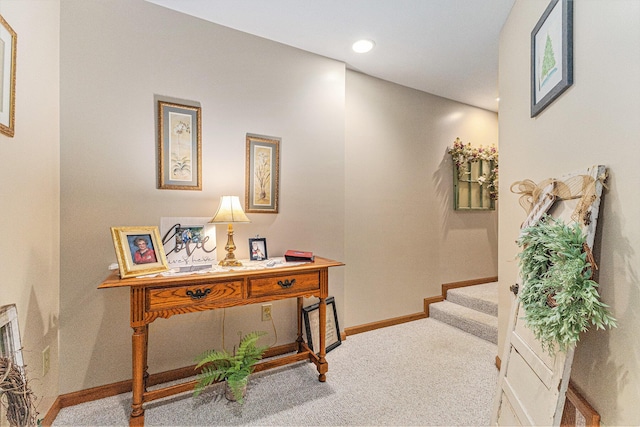hall with carpet floors, baseboards, stairway, and recessed lighting