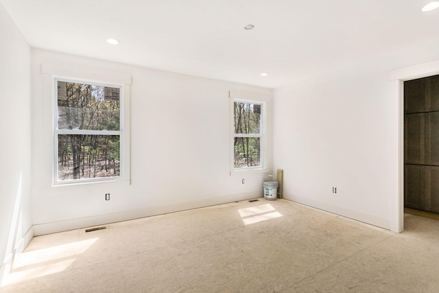 1826 S Barnes Rd, Muskegon, MI 49442 - unfurnished bedroom featuring multiple windows, recessed lighting, and baseboards