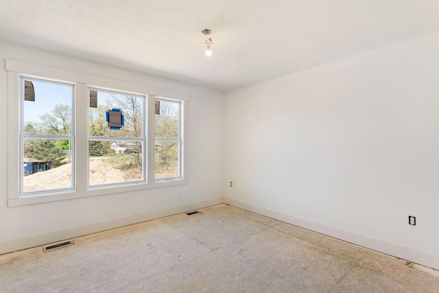 1826 S Barnes Rd, Muskegon, MI 49442 - spare room featuring baseboards