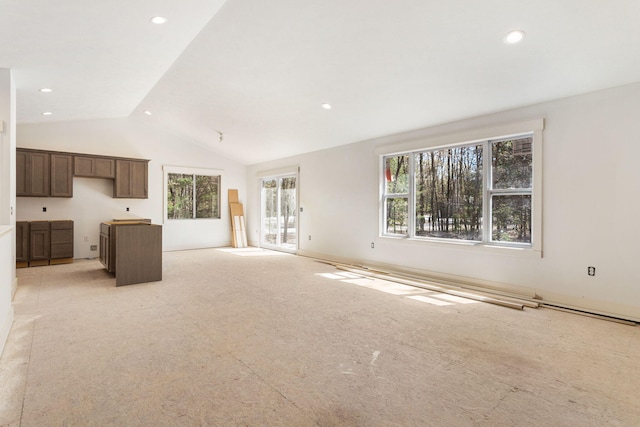 1826 S Barnes Rd, Muskegon, MI 49442 - unfurnished living room with light colored carpet, lofted ceiling, and recessed lighting