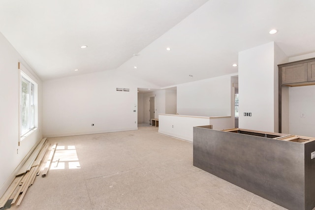 1826 S Barnes Rd, Muskegon, MI 49442 - unfurnished living room with vaulted ceiling and recessed lighting
