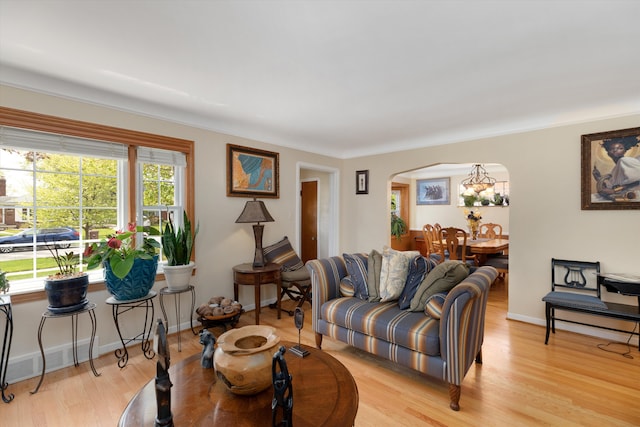 2220 Stanhope St, Grosse Pointe Woods, MI 48236 - living area featuring arched walkways, light wood-type flooring, and baseboards