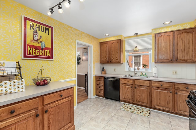 2220 Stanhope St, Grosse Pointe Woods, MI 48236 - kitchen featuring black appliances, a sink, light countertops, brown cabinetry, and backsplash