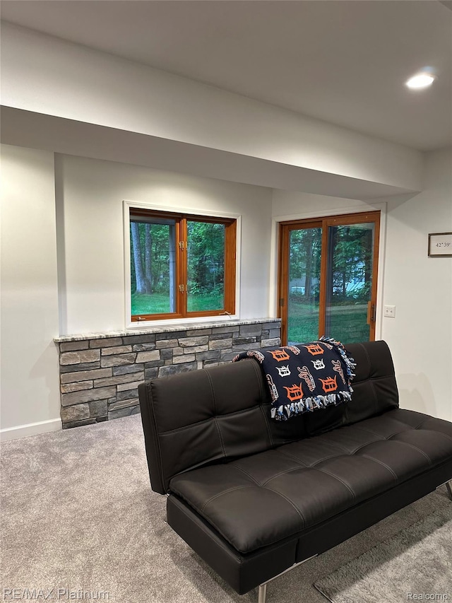 3873 Hartland Hills Dr, Hartland, MI 48353 - living room with carpet flooring, baseboards, and plenty of natural light