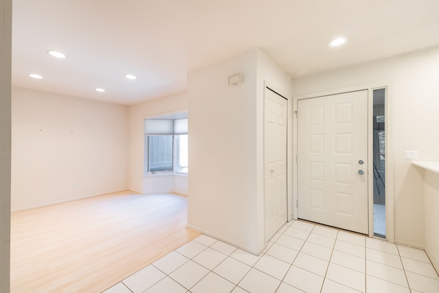 entryway with recessed lighting and baseboards