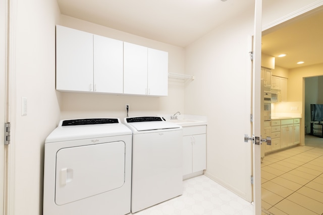 washroom with cabinet space, washer and clothes dryer, light flooring, recessed lighting, and baseboards