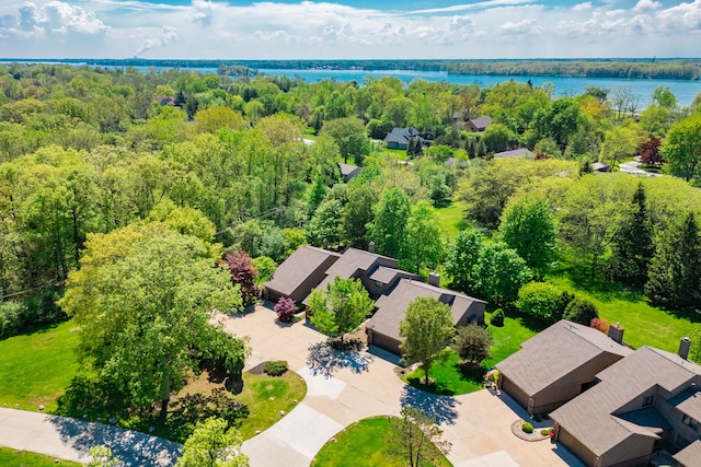 bird's eye view of a nearby body of water and a forest