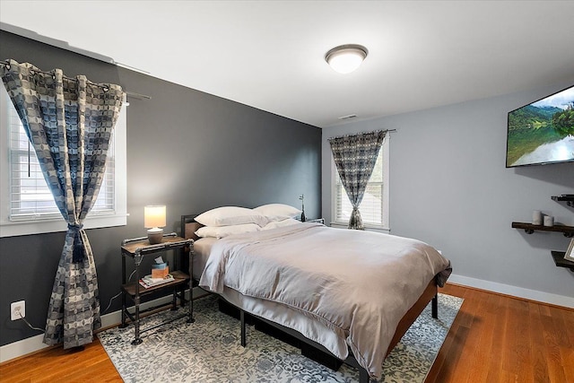 1836 Marywood Dr, Royal Oak, MI 48073 - bedroom with multiple windows, wood finished floors, and baseboards