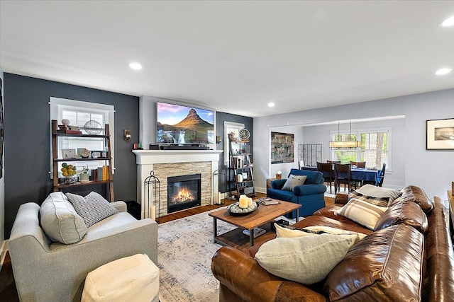 1836 Marywood Dr, Royal Oak, MI 48073 - living room with wood finished floors, a stone fireplace, and recessed lighting