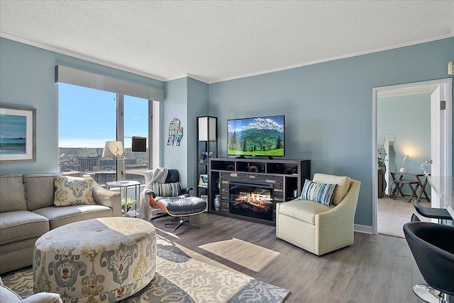 143 Campau Cir NW Unit 1616, Grand Rapids, MI 49503 - living area with wood finished floors, crown molding, and a textured ceiling