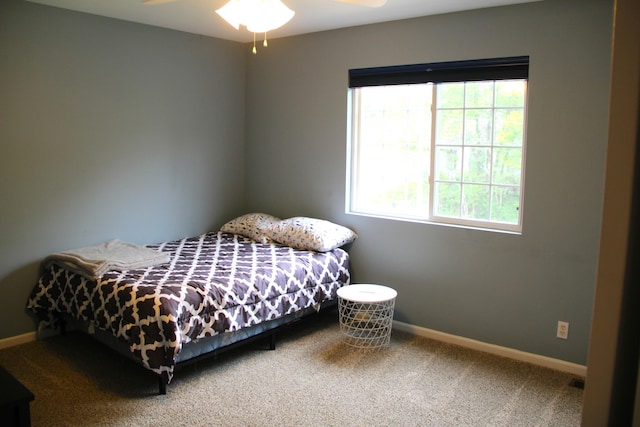 bedroom featuring carpet flooring and baseboards