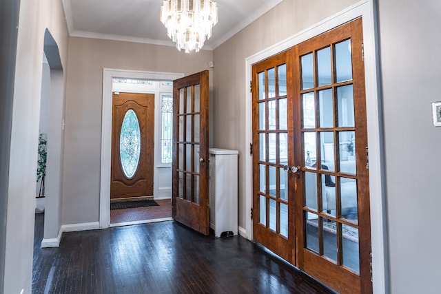 2285 Chicago Blvd, Detroit, MI 48206 - foyer entrance with french doors, wood finished floors, baseboards, arched walkways, and ornamental molding