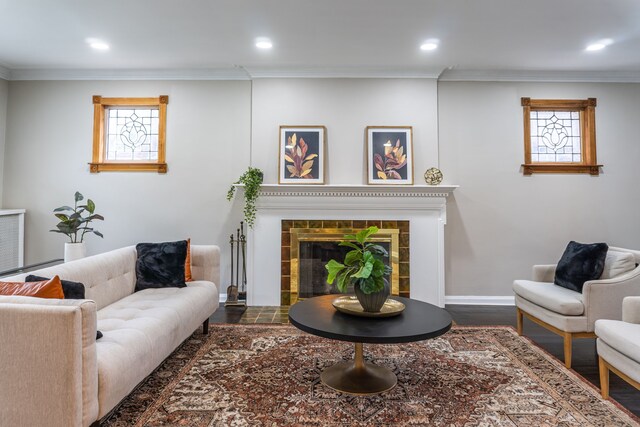 2285 Chicago Blvd, Detroit, MI 48206 - living area featuring crown molding, recessed lighting, a tile fireplace, baseboards, and wood finished floors