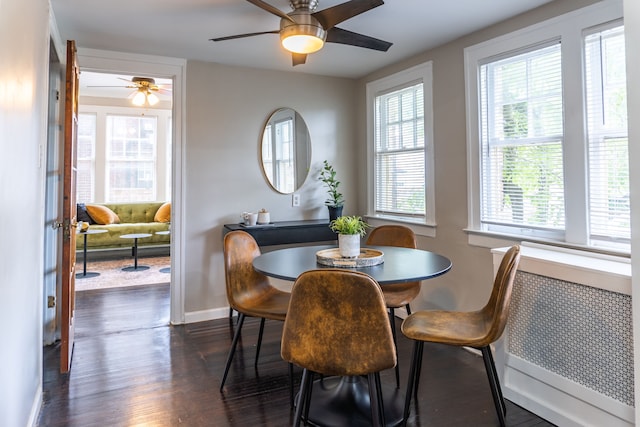 2285 Chicago Blvd, Detroit, MI 48206 - dining room featuring healthy amount of natural light, baseboards, dark wood-style floors, and ceiling fan