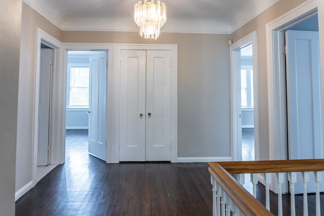 2285 Chicago Blvd, Detroit, MI 48206 - entryway featuring baseboards, dark wood-style flooring, a chandelier, and ornamental molding