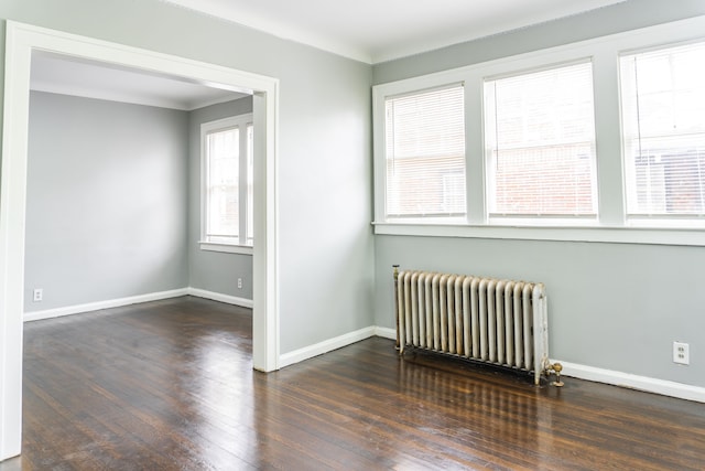2285 Chicago Blvd, Detroit, MI 48206 - unfurnished room featuring radiator heating unit, hardwood / wood-style flooring, and baseboards