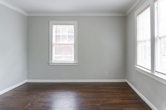 2285 Chicago Blvd, Detroit, MI 48206 - unfurnished room featuring healthy amount of natural light, dark wood-style floors, and baseboards