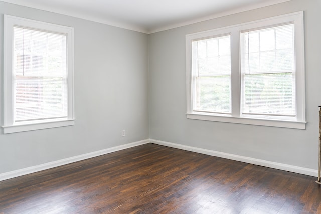 2285 Chicago Blvd, Detroit, MI 48206 - spare room featuring baseboards and dark wood-type flooring