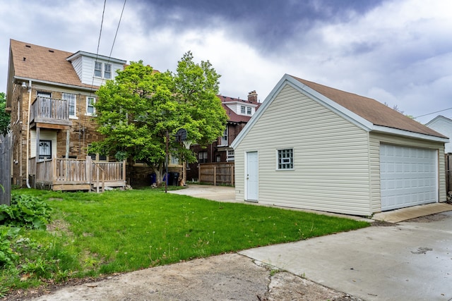 2285 Chicago Blvd, Detroit, MI 48206 - view of home's exterior with an outbuilding, a lawn, and a garage